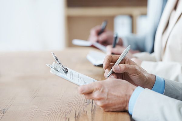 Image of forms being filled in